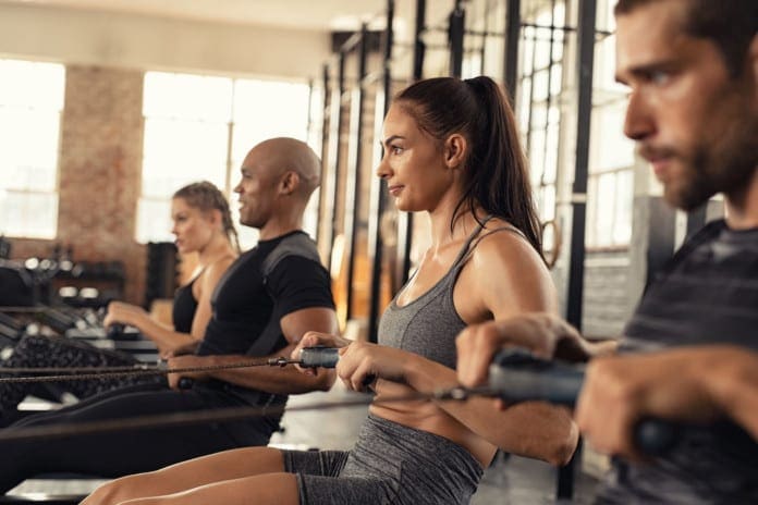 Fitness class training on rowing machine