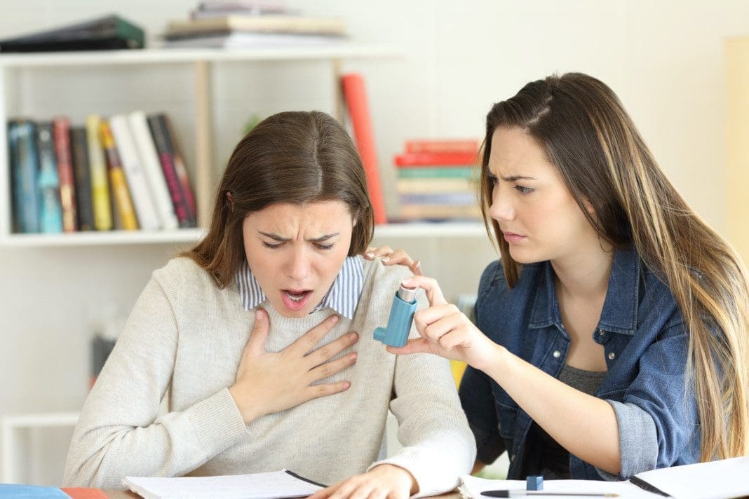 Student helping her asmathic friend