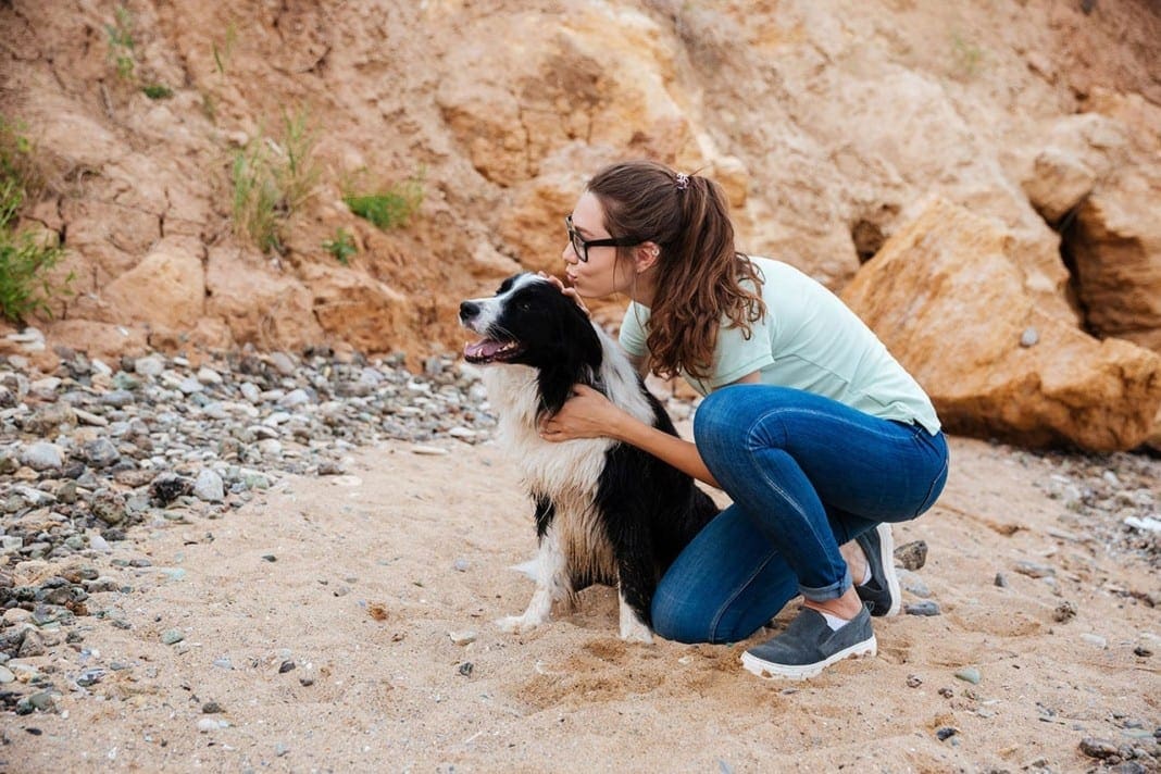 Happy charming young woman sitting and hugging her dog 11860 Vista Del Sol, Ste. 128 Pets Healing Power Can Be Powerful Medicine