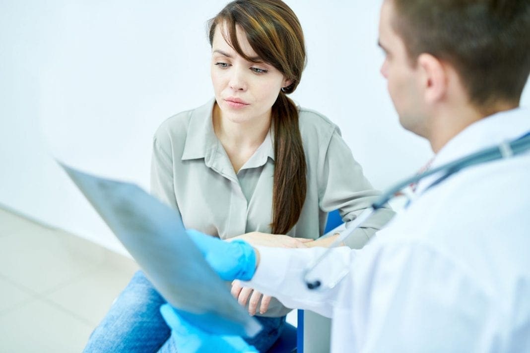 Doctor Explaining X-Ray Image 11860 Vista Del Sol, Ste. 128 Certain Medications Increase Risk for Osteoporosis and Spinal Fractures