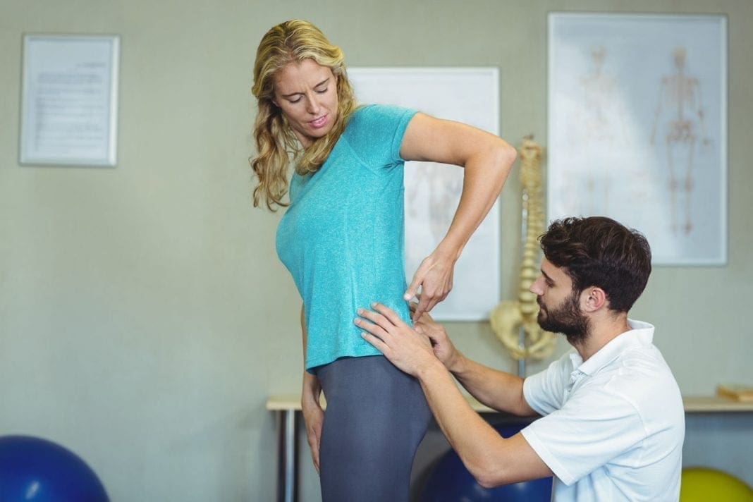 Physiotherapist examining womans back 11860 Vista Del Sol, Ste. 128 When Sciatica Is Not Spine Related