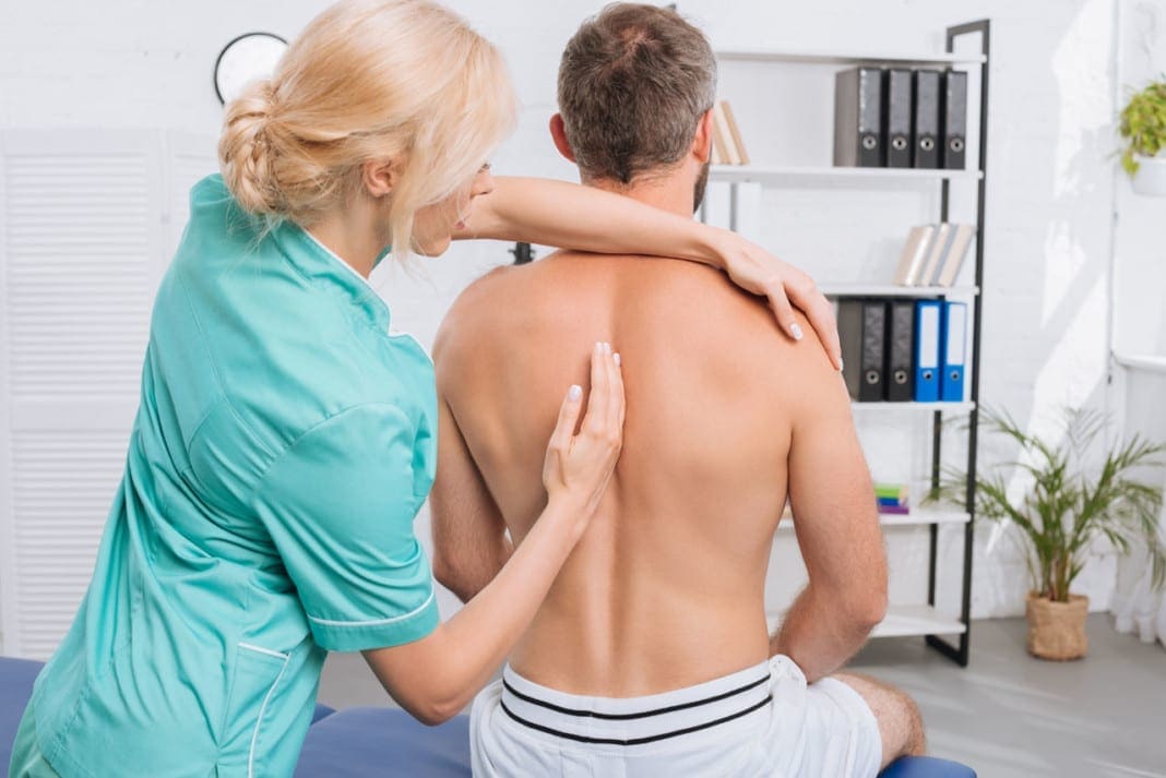 back view of man having chiropractic adjustment in clinic 11860 Vista Del Sol, Ste. 128 Metabolic Syndrome and Chiropractic Body Wellness