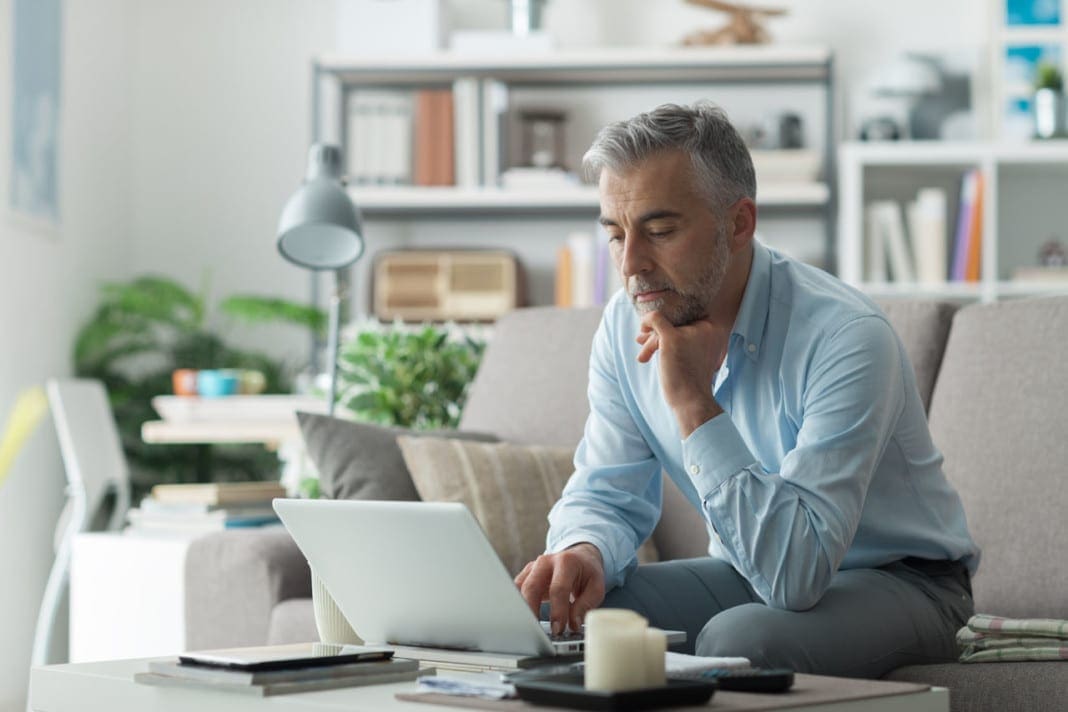 Businessman working at home 11860 Vista Del Sol, Ste. 128 Activity Modification and Chiropractic To Help With Chronic Pain