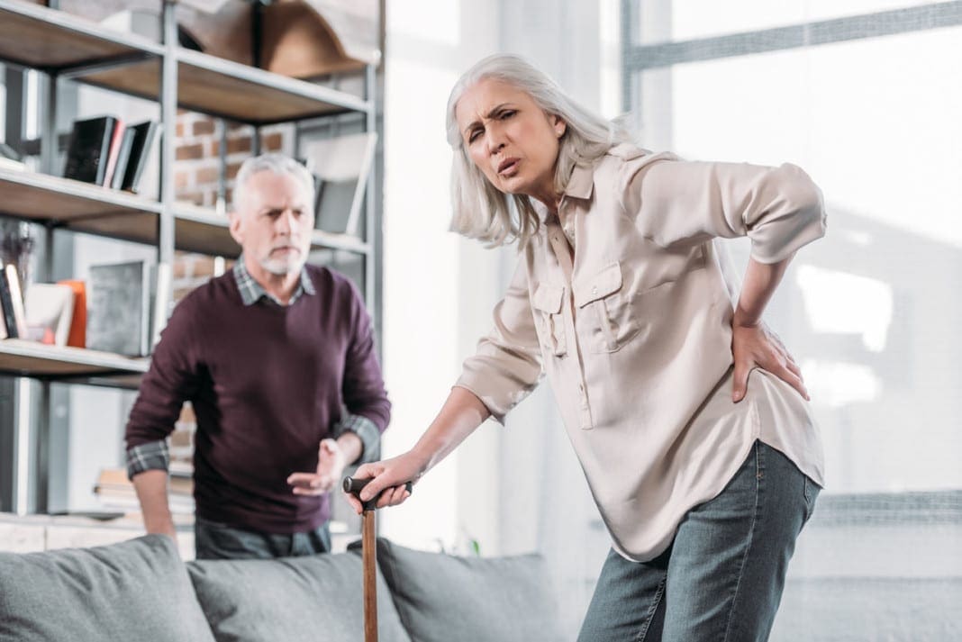 senior woman suffering from strong back pain at home 11860 Vista Del Sol, Ste. 128 The Lumbosacral Joint and Possible Cause For Sciatic Nerve Pain