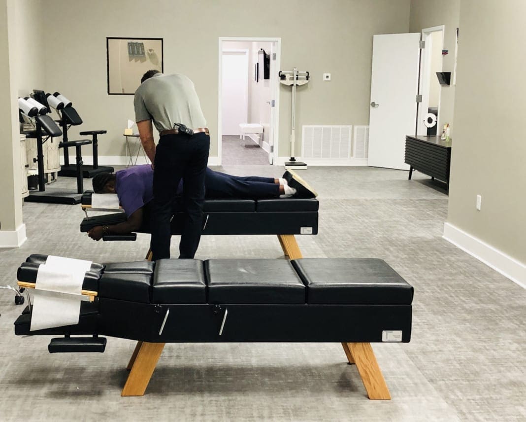 chiropractor-giving-an-adjustment-J4BELK5_02 11860 Vista Del Sol, Ste. 128 Chiropractic Relief From Pinched Nerves