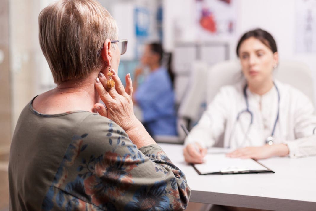Senior woman with neck pain