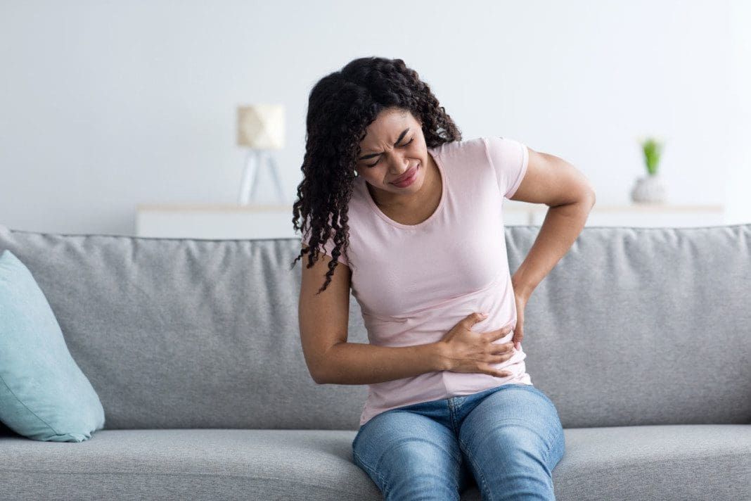 Health care, illness, pain in abdomen, side and back