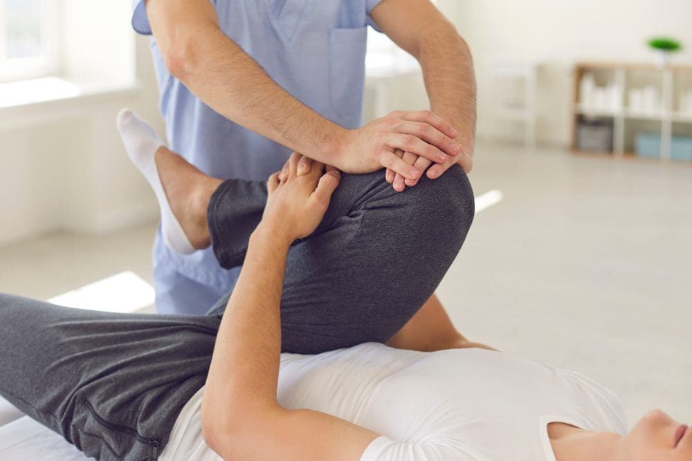 Cropped,Image,Of,A,Physiotherapist,Massaging,And,Kneading,A,Patient's