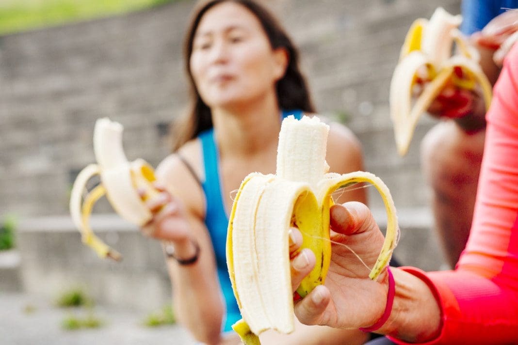 People eating bananas