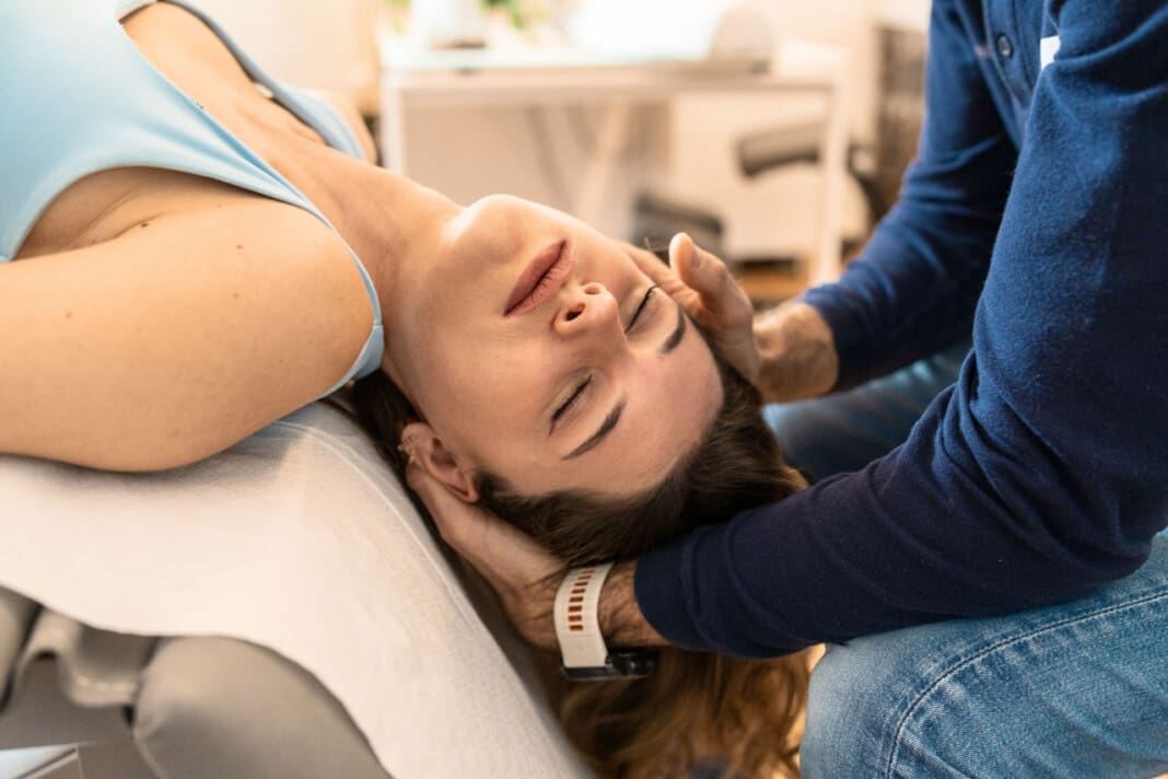 Osteopathic Neck Adjustment - Physical Therapist Assisting with Shoulder Rehabilitation