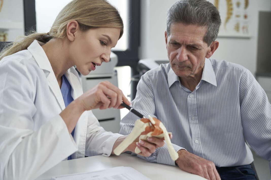 Female caucasian doctor talking with her patient