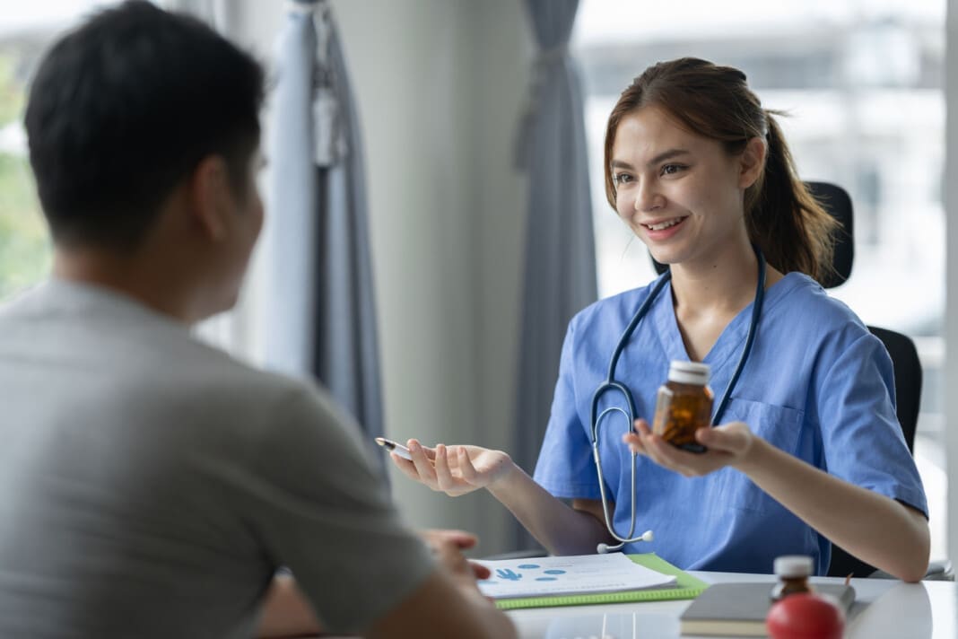 Confident female doctor with medical stethoscope introducing and