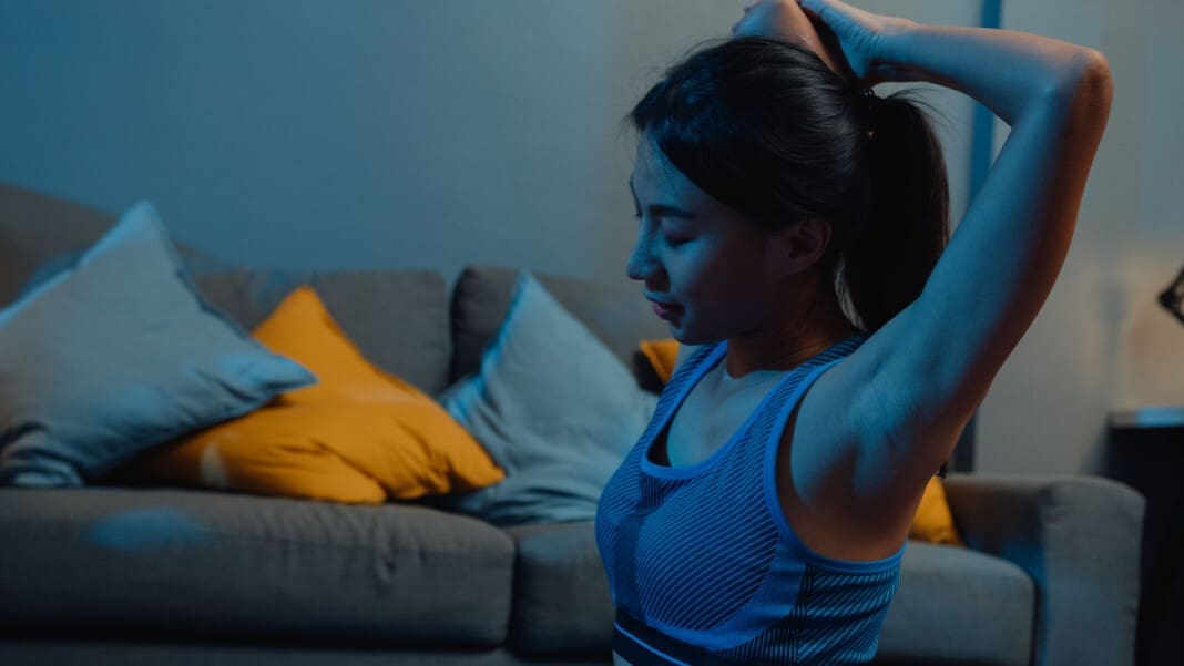 Young Asia lady in sportswear doing yoga exercise working out in