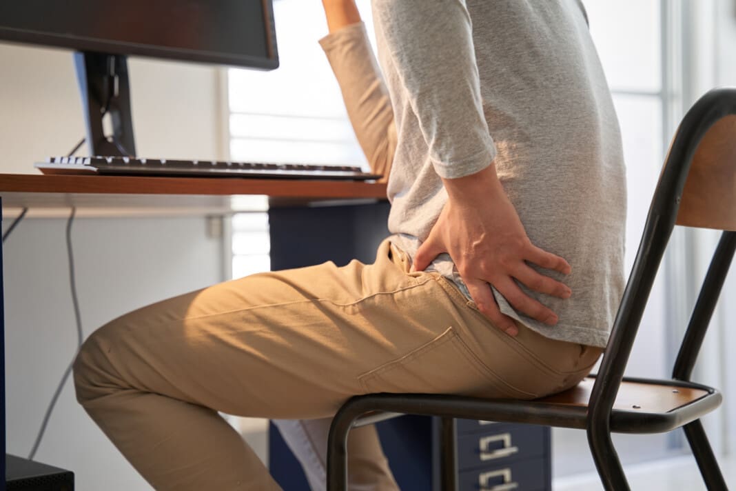 japanese-male-businessman-who-suffers-back-pain-fr-2025-03-16-20-31-37-utc