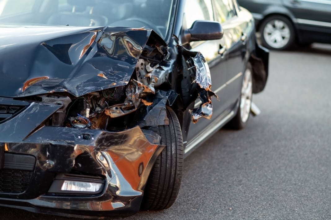Close-up of damaged car part after accident showing broken metal and scratches El Paso Parking Lot Injury Recovery Strategies for You